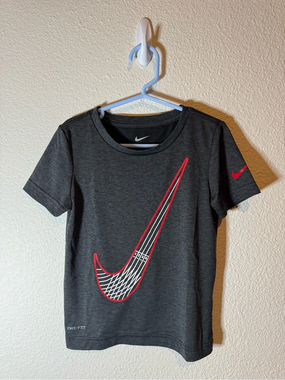 Nike Kids' Dark Gray Short Sleeve Dri-FIT Tee with Red Swoosh